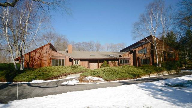 495 Westover Road Stamford, CT 06902 - Photo 1 of 1 a view of a white house next to a road and yard