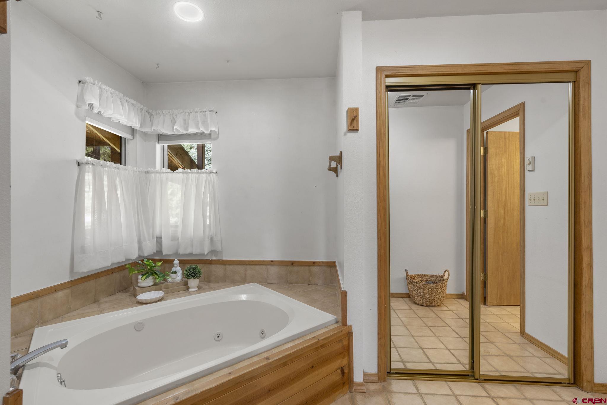 37 Verde Lane Durango, CO 81301 - Photo 19 of 45 a bathroom with a tub and shower