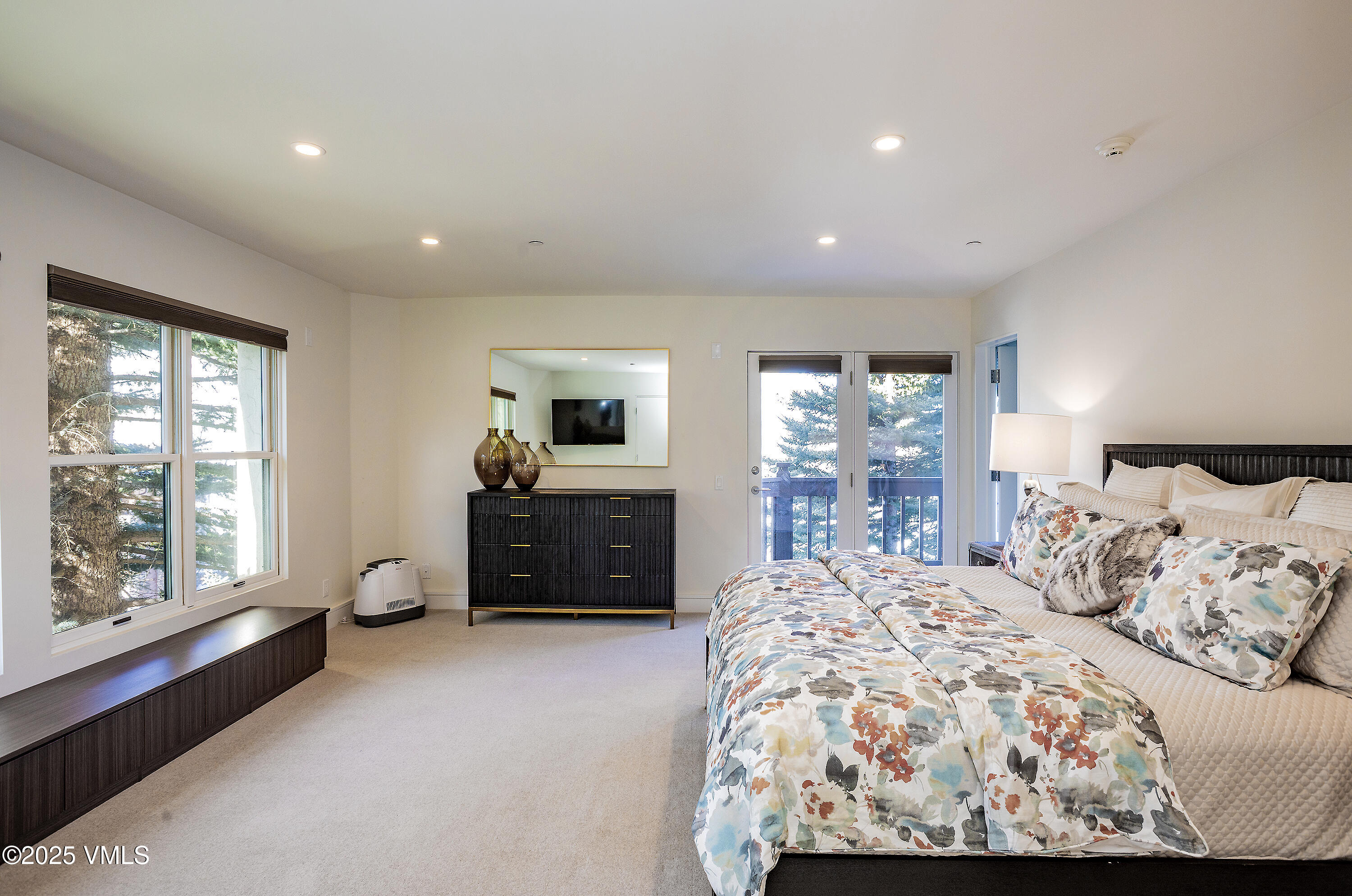 83 Offerson Road, Unit 1 Beaver Creek, CO 81620 - Photo 11 of 27 a bed room with a bed window and a television