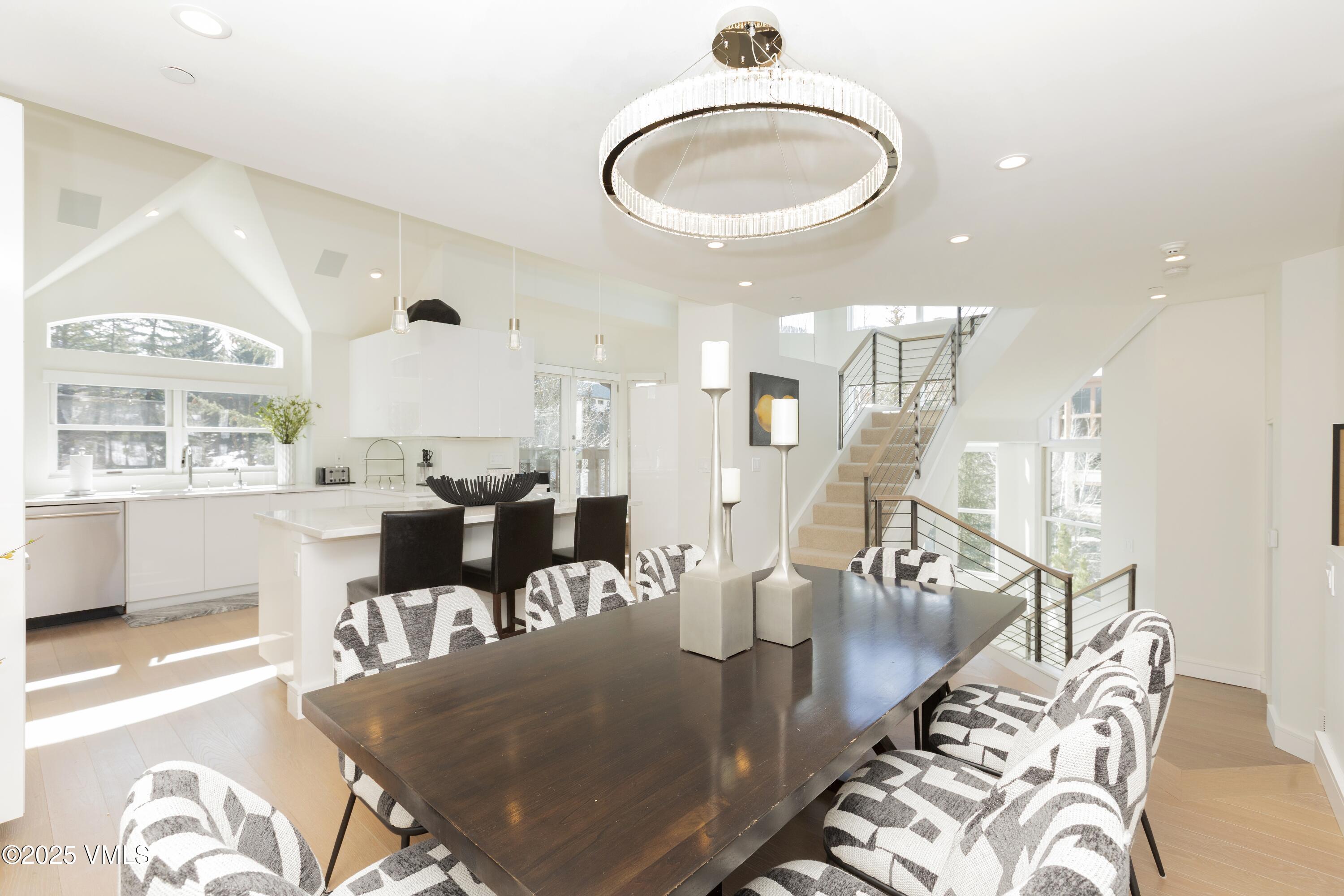 83 Offerson Road, Unit 1 Beaver Creek, CO 81620 - Photo 5 of 27 a view of kitchen and dining room with wooden floor