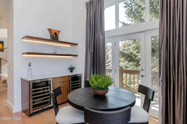 a dining room with a table and chairs