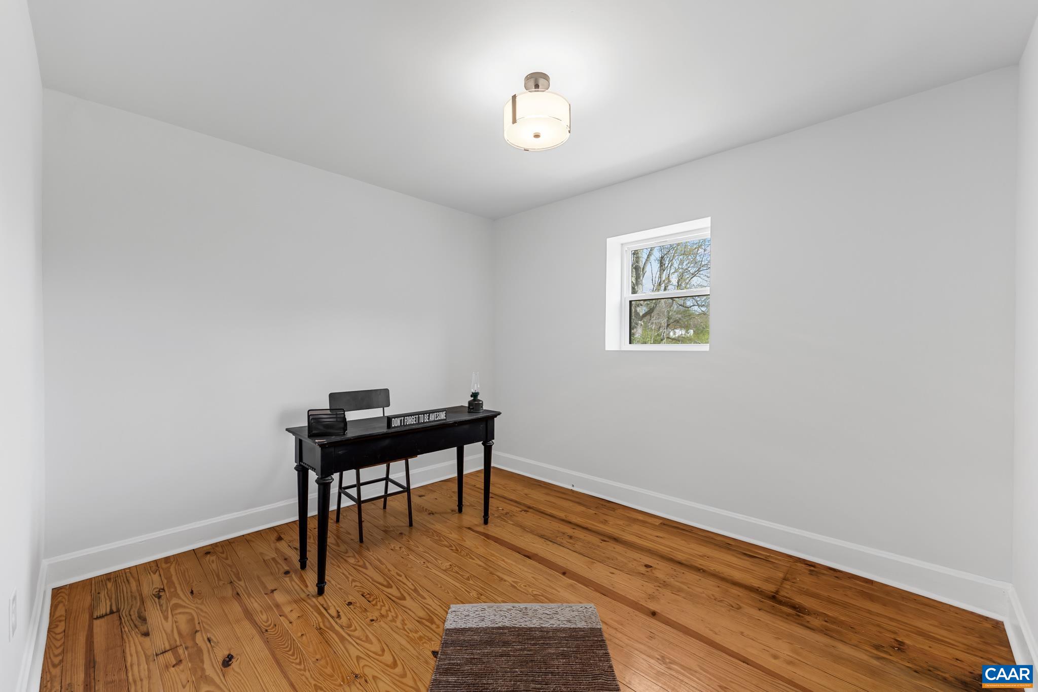 2733 Cedar Lane Road Kents Store, VA 23084 - Photo 22 of 43 The space offers exceptional versatility and is ideally suited as a first floor office or bedroom space. Featuring hardwood floors and conveniently located near main living areas, it provides both comfort and accessibility for todays flexible lifestyle