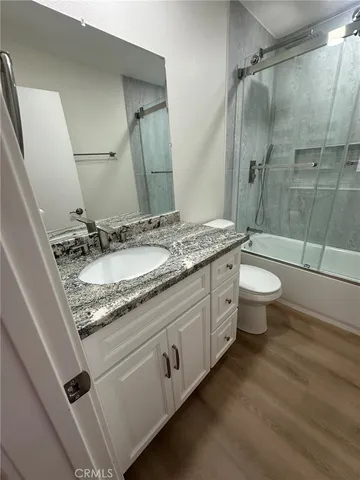 a bathroom with a shower and a toilet