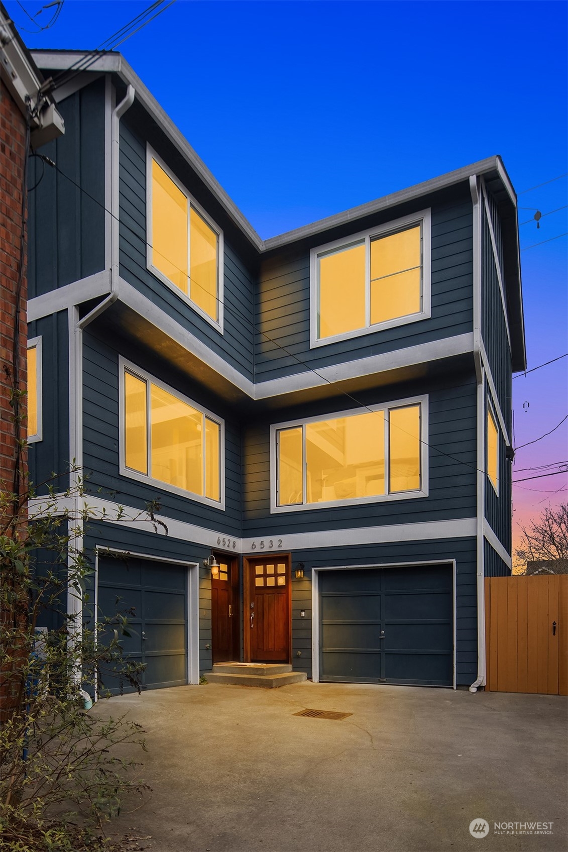 a view of a building with a door and a garage