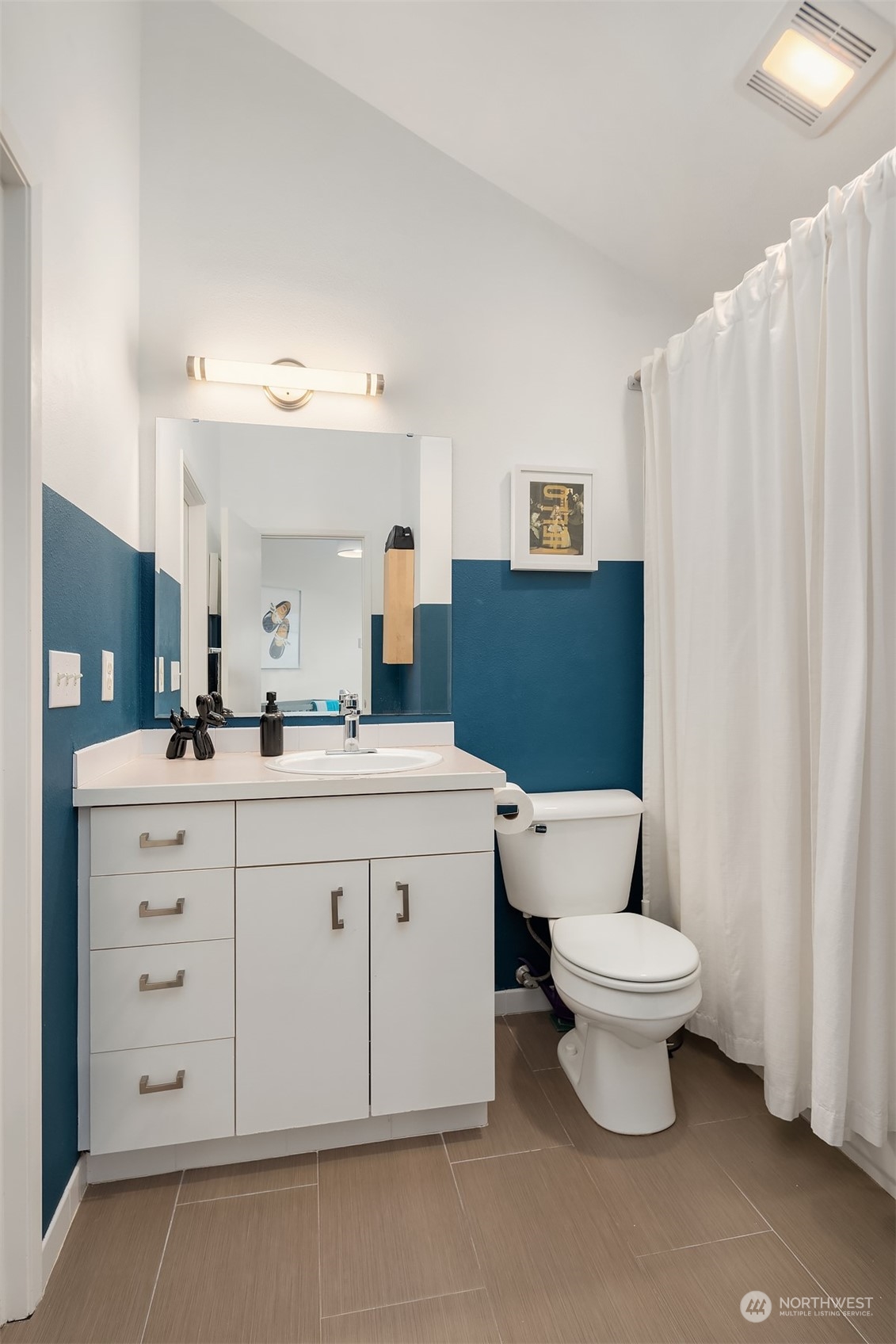 6528 34th Avenue Southwest Seattle, WA 98126 - Photo 9 of 13 a bathroom with a sink toilet and shower