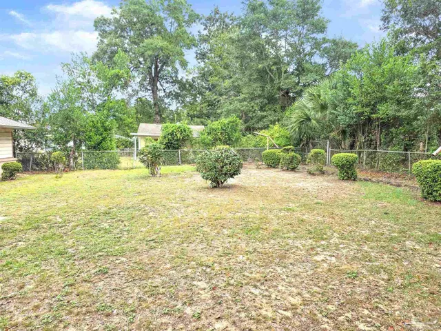 a front view of house with yard outdoor seating and green space