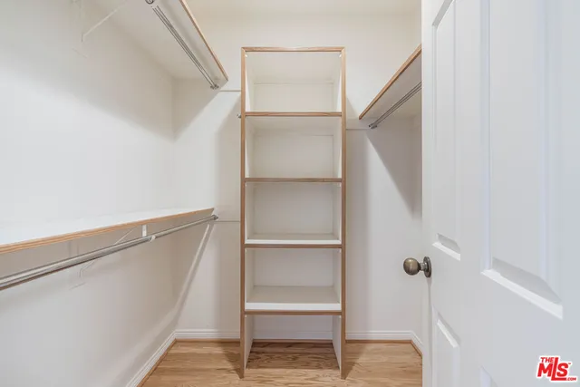 a view of an empty walk in closet