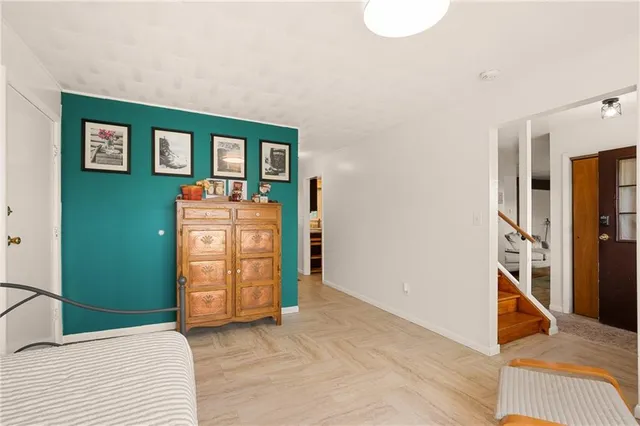 a bathroom with a sink toilet and a mirror