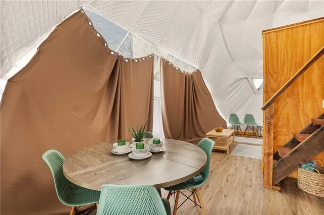 a swimming pool with outdoor seating and yard