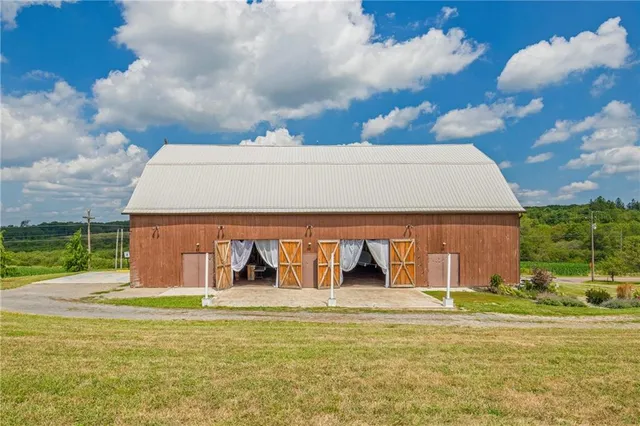 a balcony with table and chairs