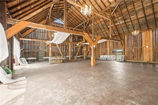 a dining room with furniture and floor to ceiling windows