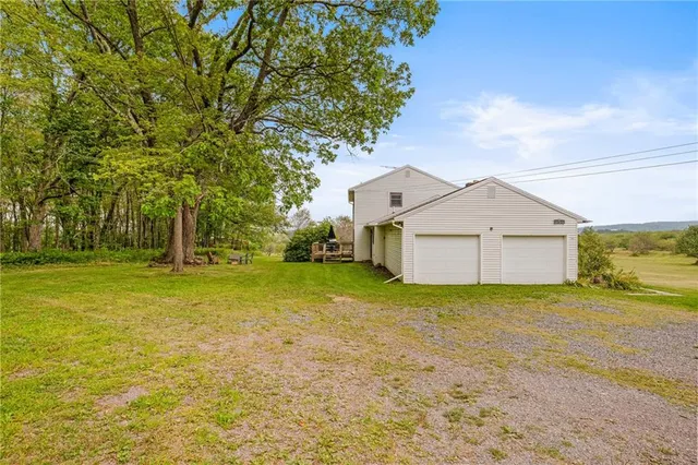 a view of a house with large windows and stairs