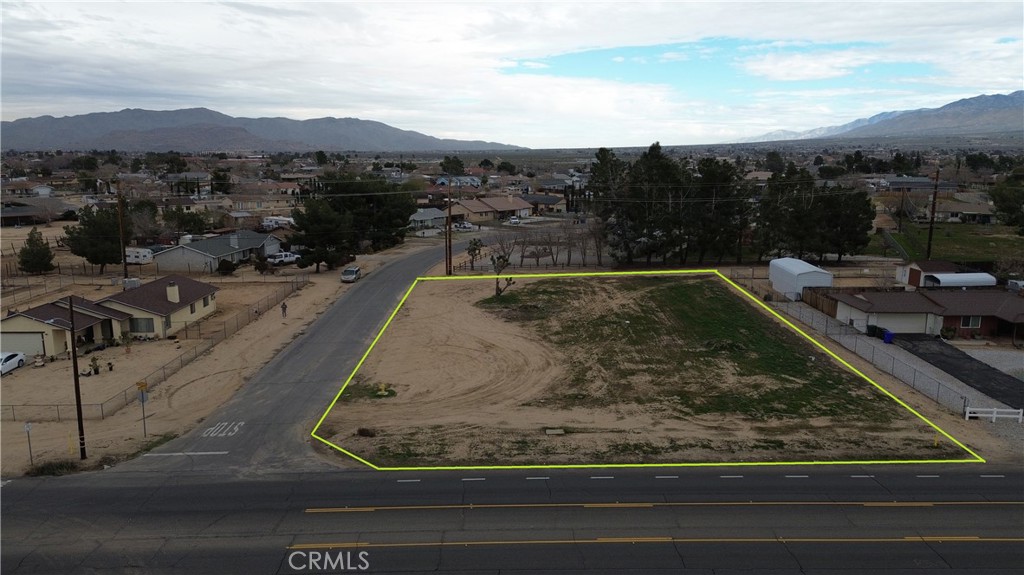 43431107 Kiowa Road Apple Valley, CA 92308 - Photo 3 of 16 a view of a swimming pool with a yard and mountain view