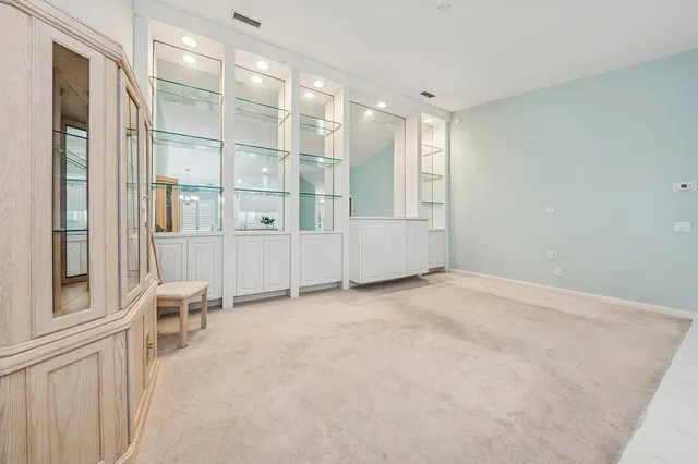 a kitchen with a sink cabinets and window