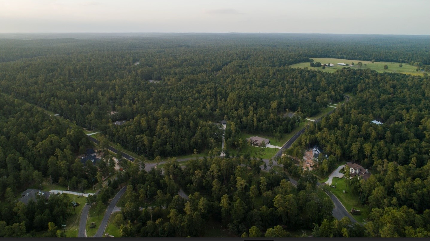 11-24-79 Sanctuary Road Huntsville, TX 77340 - Photo 9 of 26 an aerial view of residential house and green space