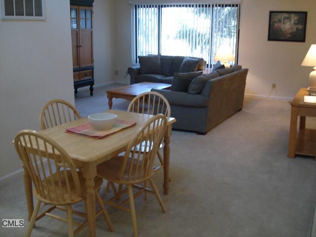 80 Lawson Lane Ridgefield, CT 06877 - Photo 1 of 1 a living room with furniture and a large window