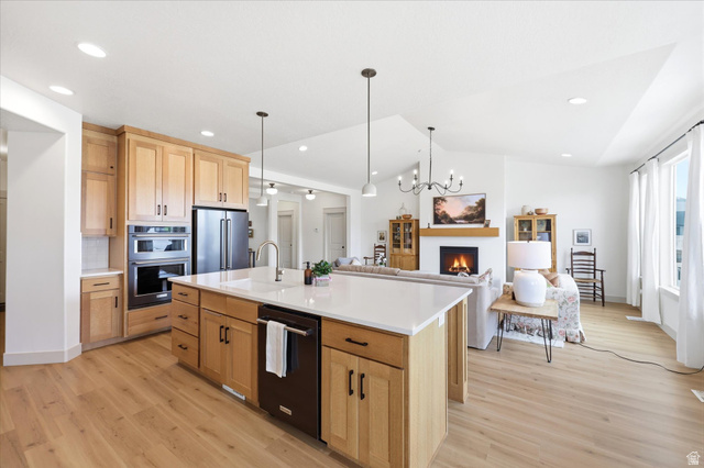 283 North 500 West Mapleton, UT 84664 - Photo 101 of 102 Kitchen featuring open floor plan, light wood finish cabinetry, light wood-style floors, stainless steel appliances, and lofted ceiling.