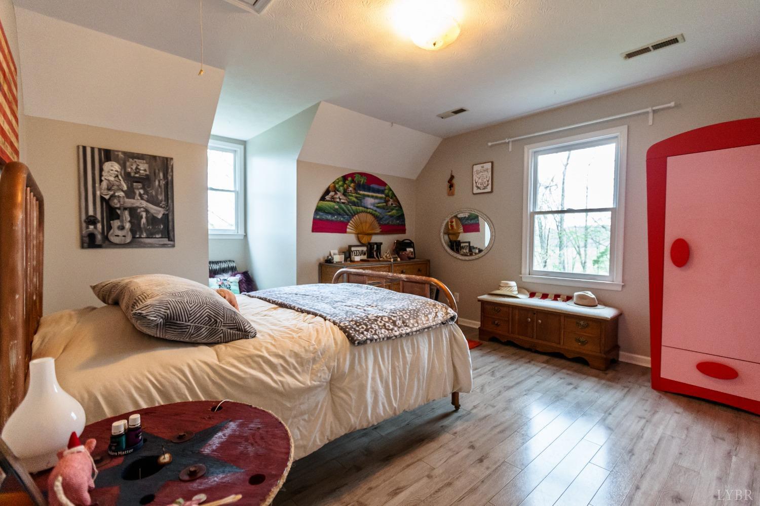 1287 Purdum Mill Road Appomattox, VA 24522 - Photo 23 of 40 a bedroom with a bed and a window
