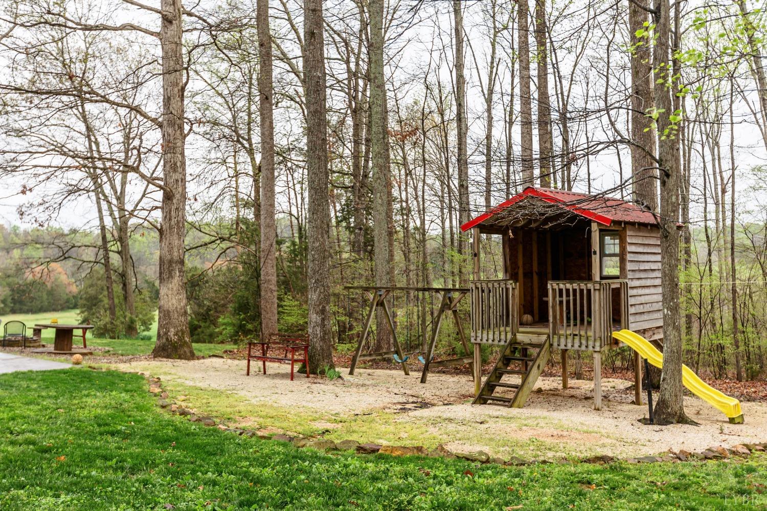 1287 Purdum Mill Road Appomattox, VA 24522 - Photo 6 of 40 a view of a park with swings and slides