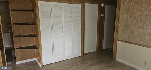 an empty room with wooden floor