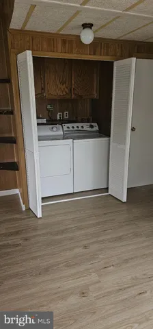 a view of cabinets and wooden floor