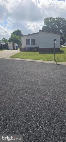 a view of an house with a yard and swimming pool