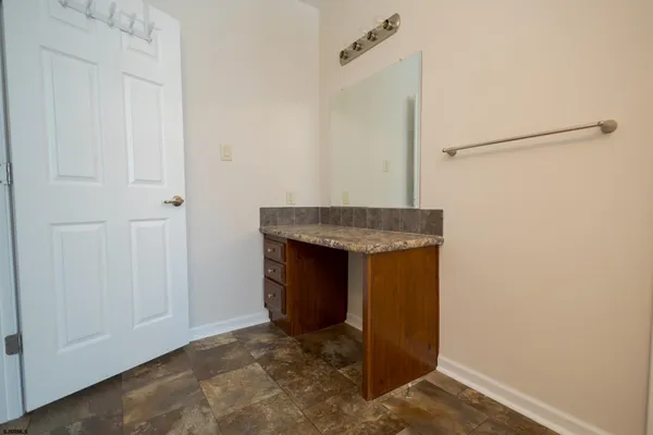 a view of an empty room with hallway