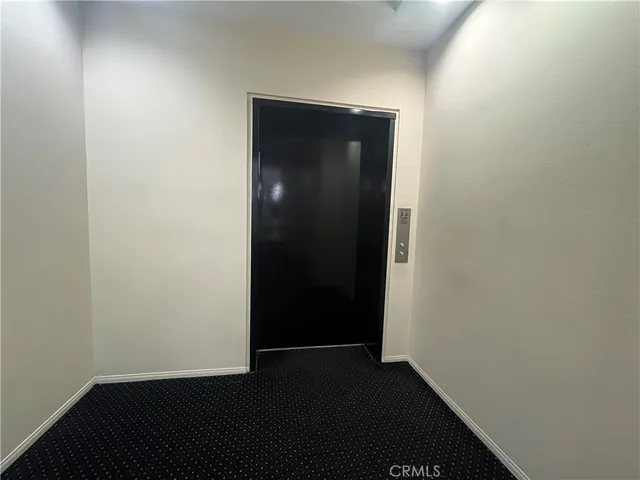 an empty room with wooden floor