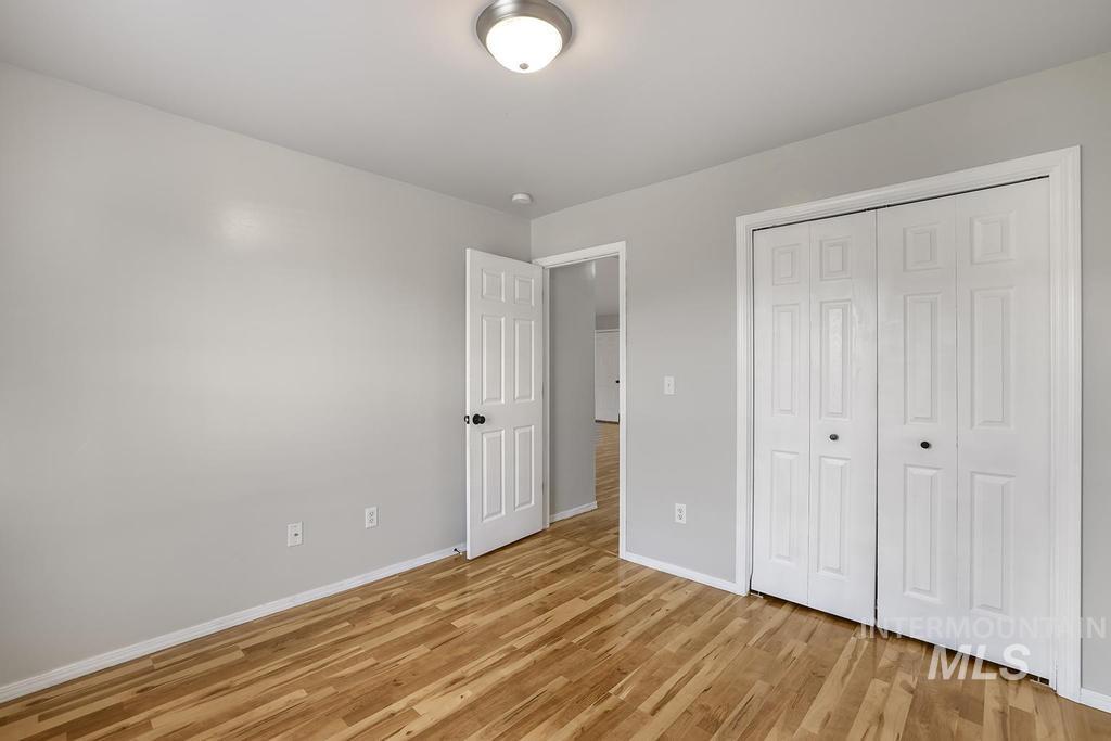 1393 Valencia Street Twin Falls, ID 83301 - Photo 13 of 44 Unfurnished bedroom with light wood-type flooring and a closet