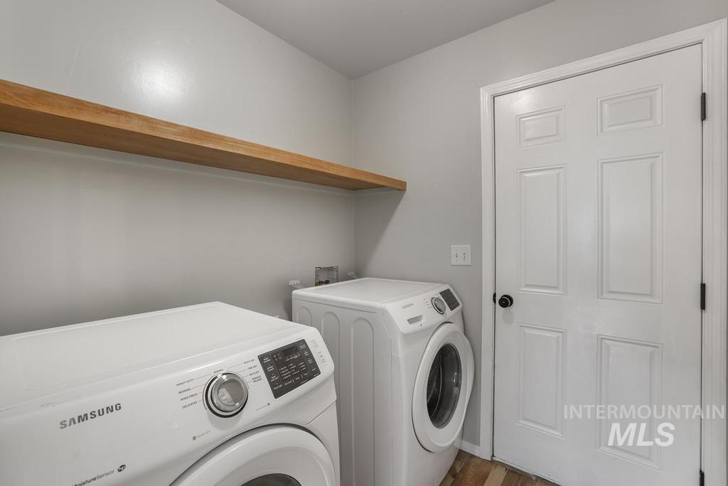 1393 Valencia Street Twin Falls, ID 83301 - Photo 14 of 44 Laundry area featuring independent washer and dryer and wood finished floors