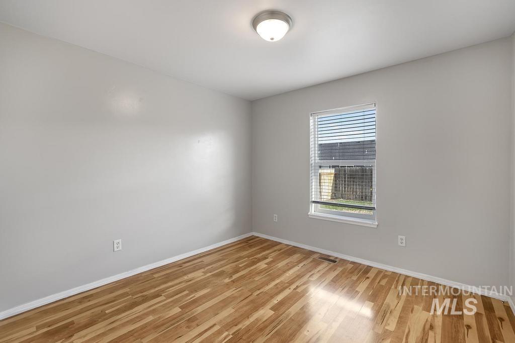1393 Valencia Street Twin Falls, ID 83301 - Photo 15 of 44 Unfurnished room with baseboards and light wood-style flooring