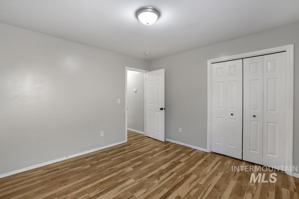 1393 Valencia Street Twin Falls, ID 83301 - Photo 22 of 44 Unfurnished bedroom with light wood-type flooring and a closet