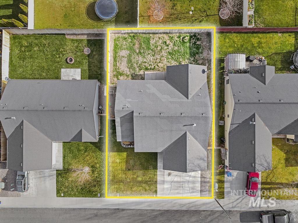 1393 Valencia Street Twin Falls, ID 83301 - Photo 26 of 44 Aerial perspective of suburban area featuring property parcel outlined