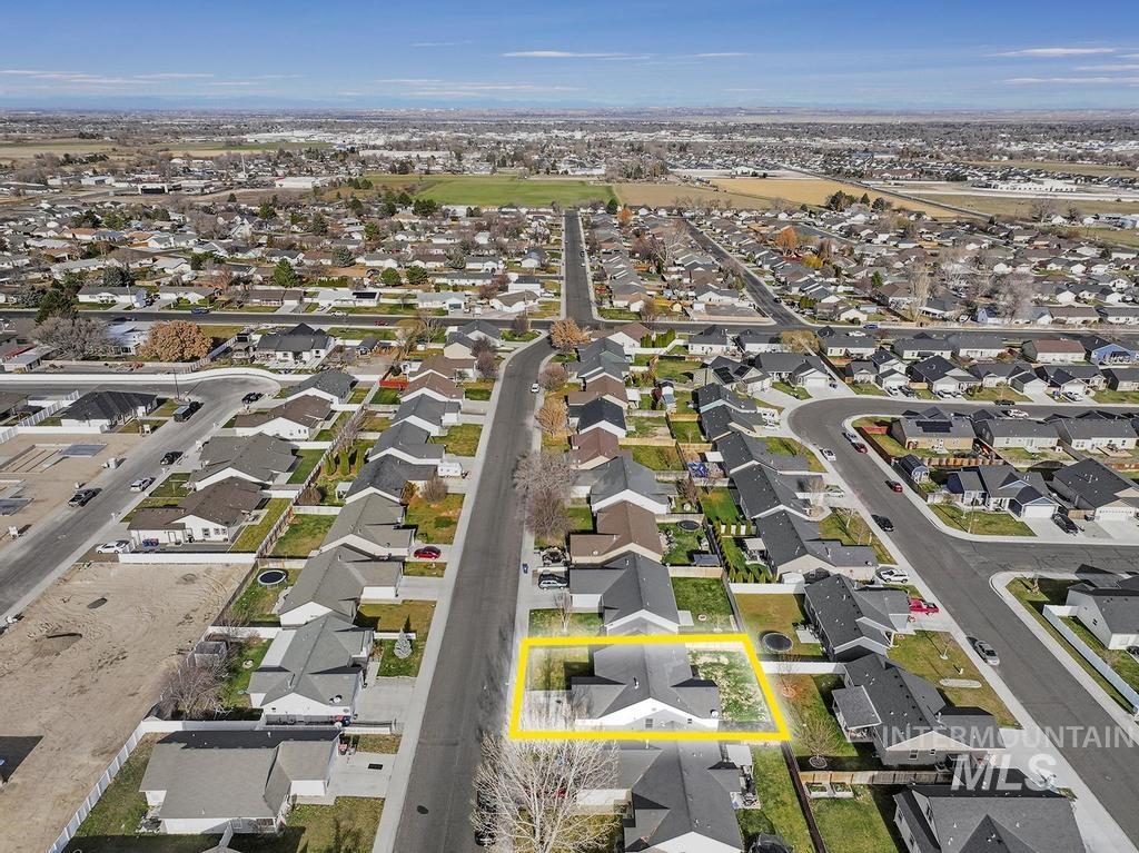 1393 Valencia Street Twin Falls, ID 83301 - Photo 32 of 44 Aerial view of property and surrounding area featuring nearby suburban area and property parcel outlined
