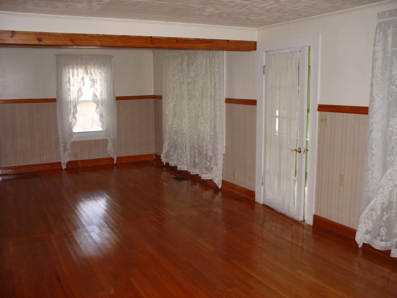 4463 Daugherty Road Salem, VA 24153 - Photo 5 of 18 an empty room with wooden floor and windows