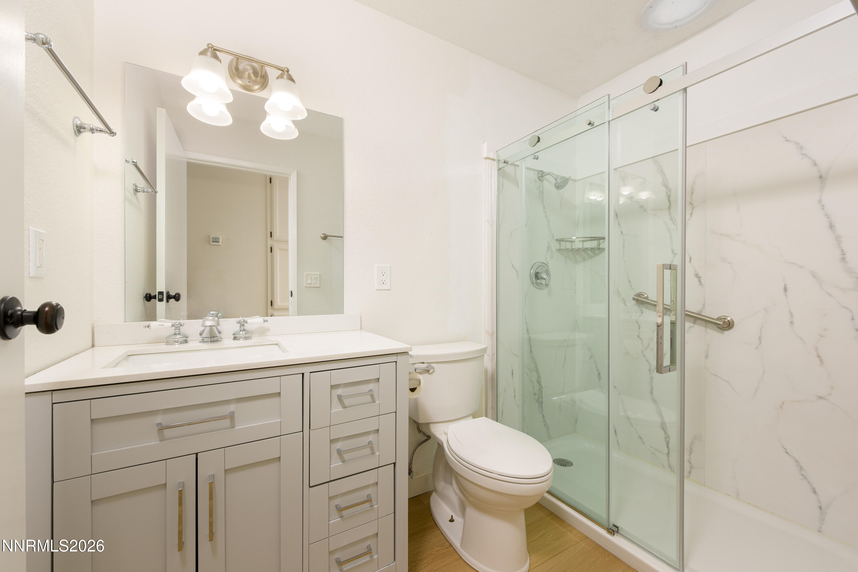 837 Mahogany Drive Minden, NV 89423 - Photo 13 of 31 a bathroom with a sink a toilet and shower