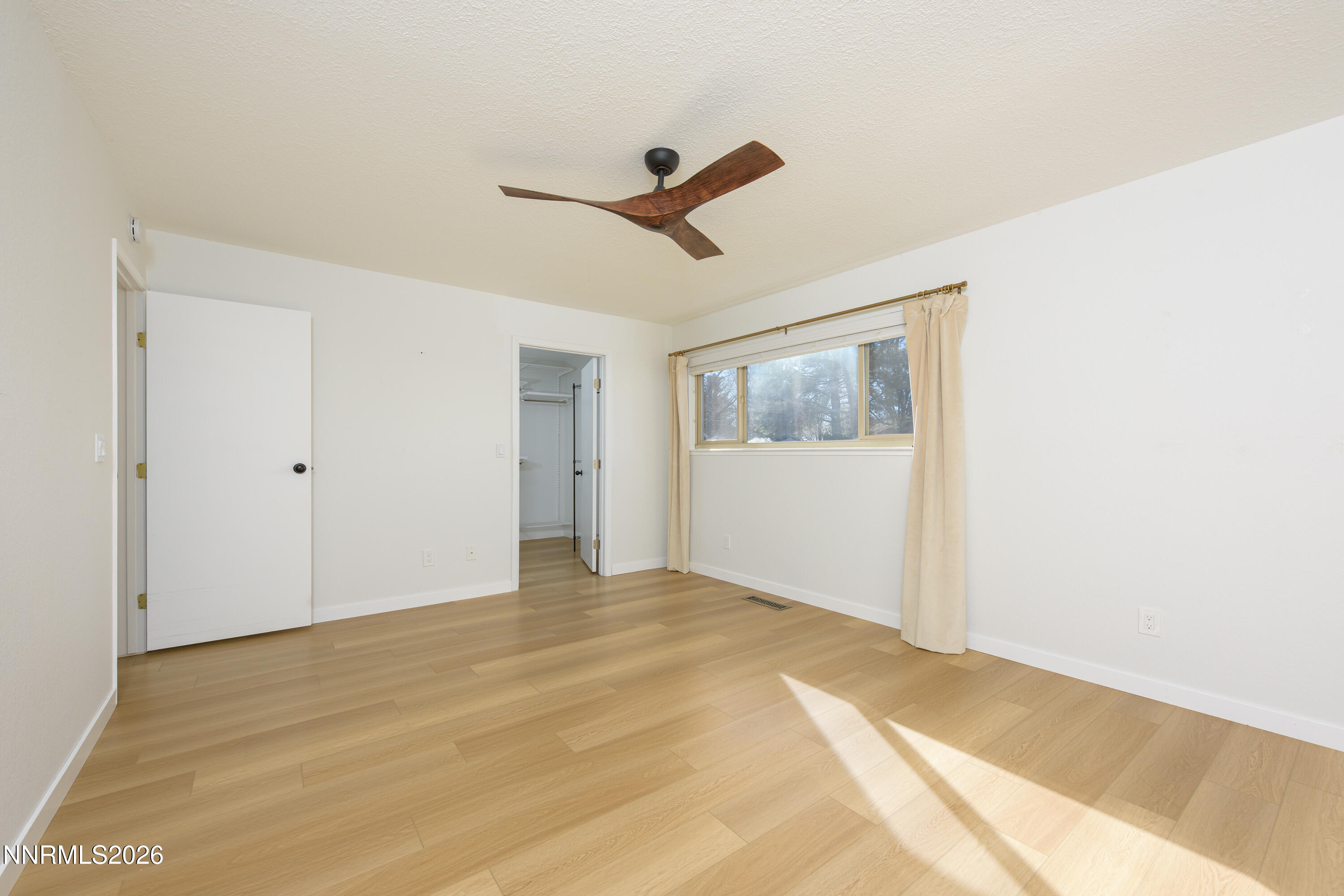 837 Mahogany Drive Minden, NV 89423 - Photo 18 of 31 a view of empty room with wooden floor