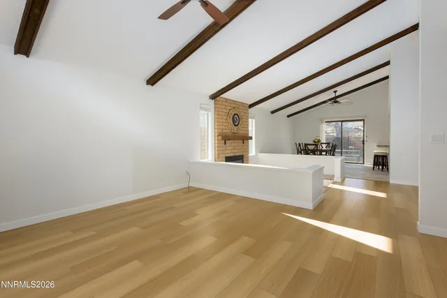 a view of a living room with kitchen island furniture and a kitchen view