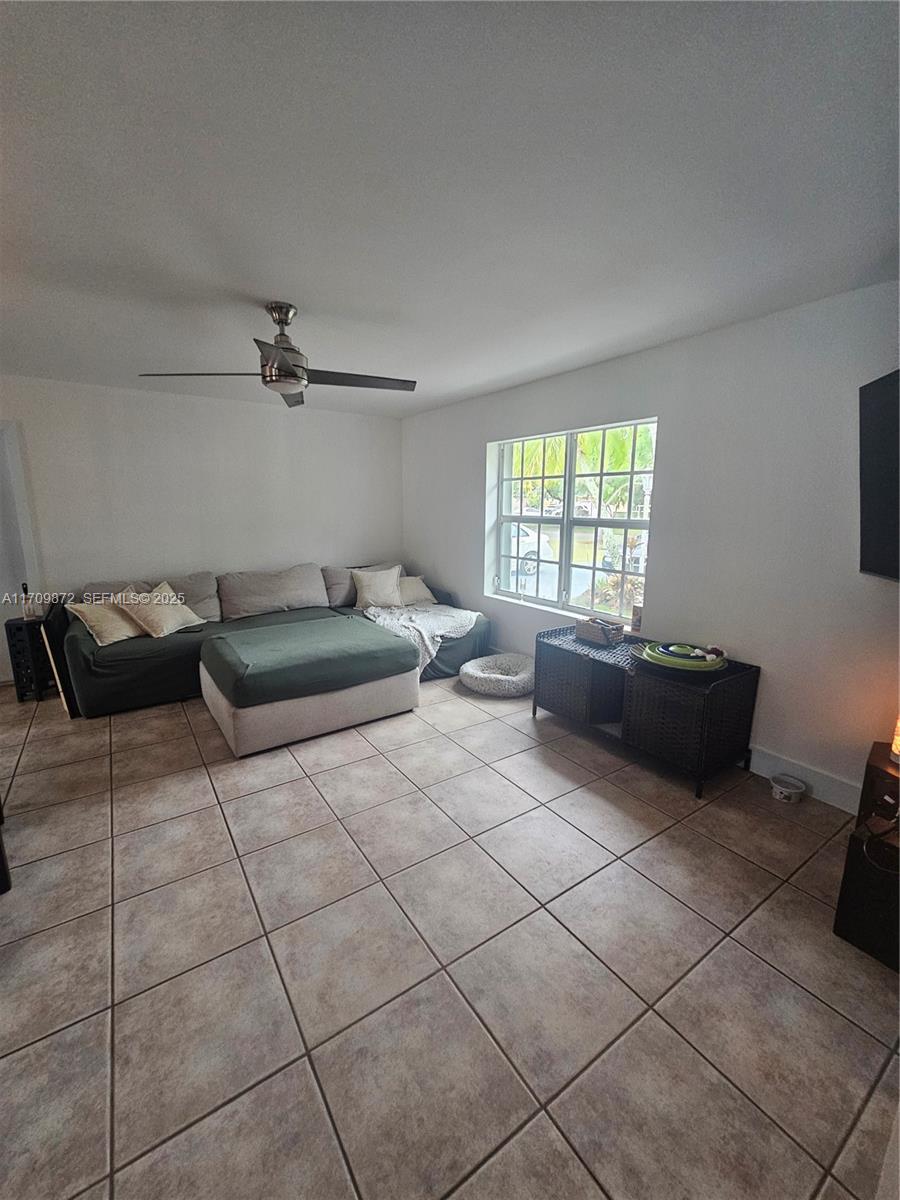14461 Southwest 152nd Court Miami, FL 33196 - Photo 12 of 30 a living room with furniture and a window