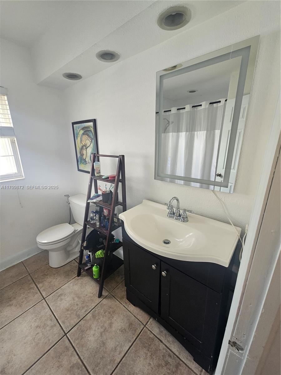14461 Southwest 152nd Court Miami, FL 33196 - Photo 24 of 30 a bathroom with a sink and a toilet