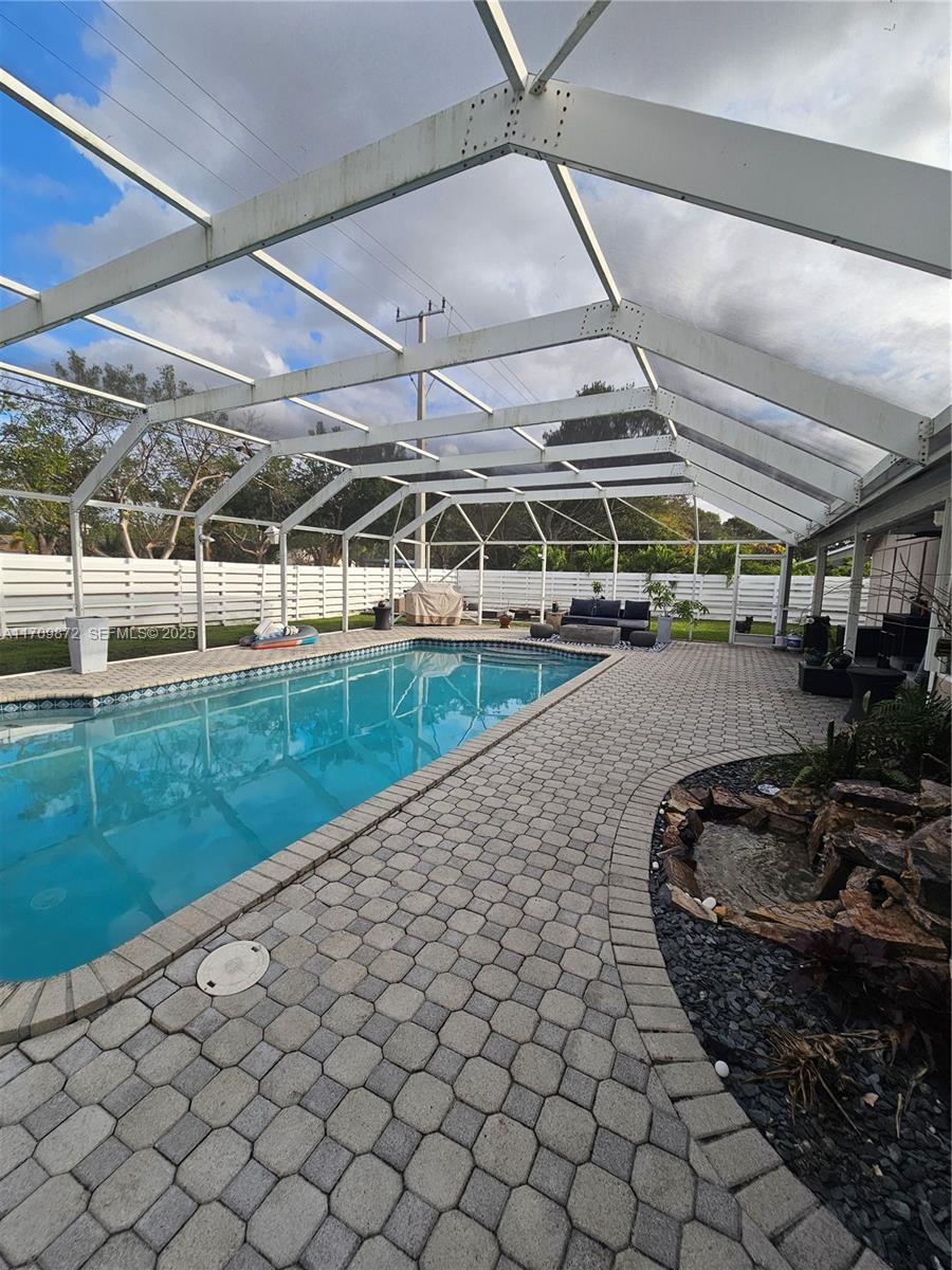 14461 Southwest 152nd Court Miami, FL 33196 - Photo 25 of 30 a view of a swimming pool and a yard