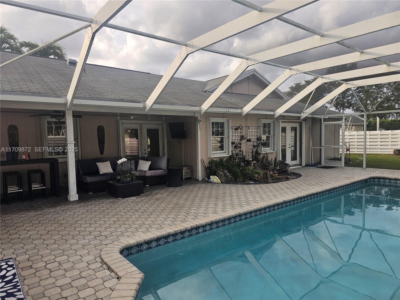 14461 Southwest 152nd Court Miami, FL 33196 - Photo 26 of 30 a view of a porch with furniture