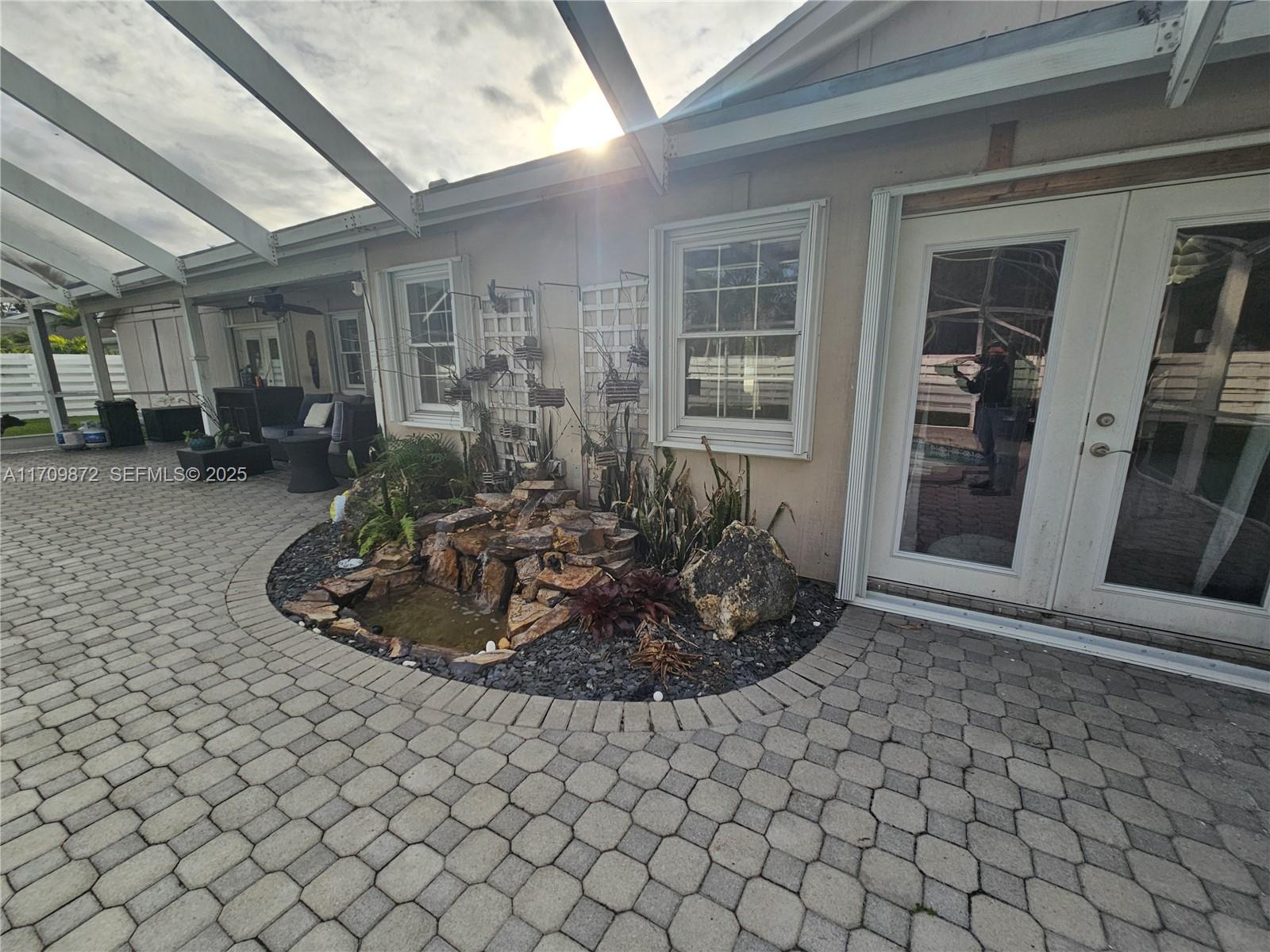 14461 Southwest 152nd Court Miami, FL 33196 - Photo 27 of 30 a view of a house with backyard and sitting area