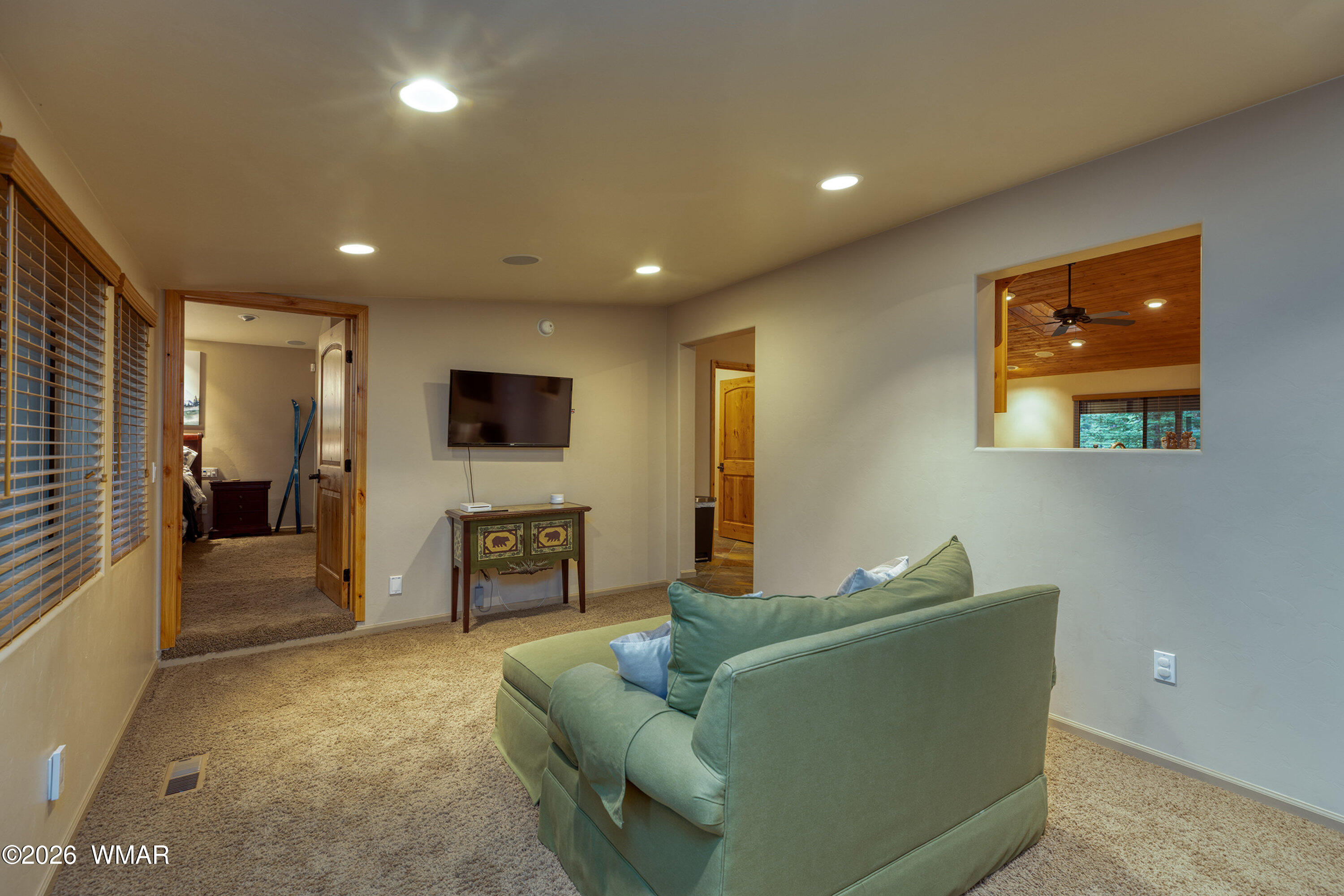 5155 Buck Springs Road Pinetop, AZ 85935 - Photo 17 of 37 a living room with furniture and a flat screen tv