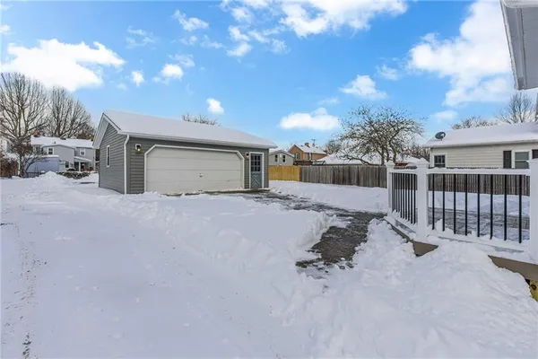 a view of a house with a snow in the yard