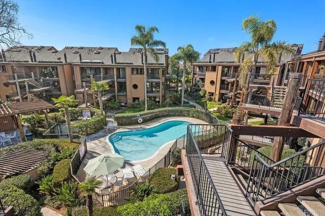 a patio with a patio table and chairs