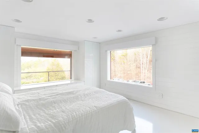 a bathroom with a tub shower and sink