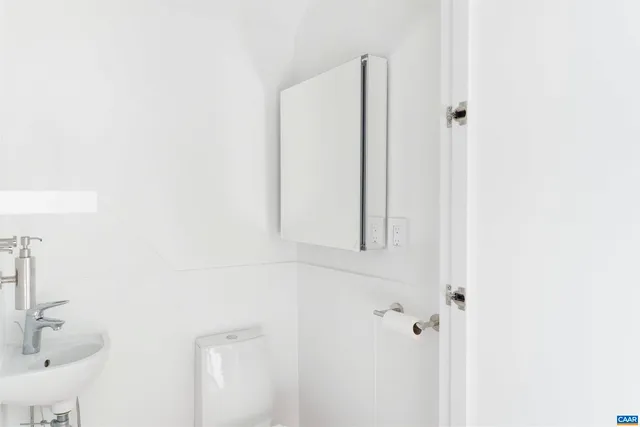a bathroom with a shower and a sink