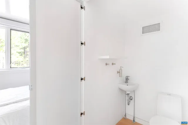 a view of balcony with wooden floor