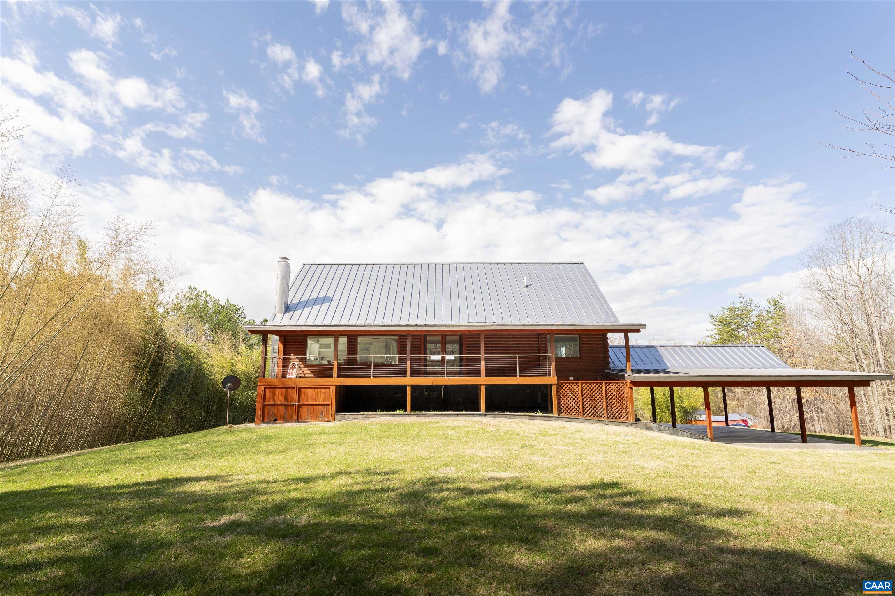 4323 Carter Road Schuyler, VA 22969 - Photo 3 of 54 a front view of a house with a yard